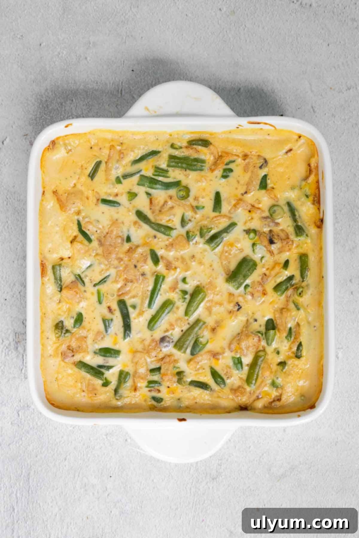 The green bean casserole baking in the oven until bubbly.