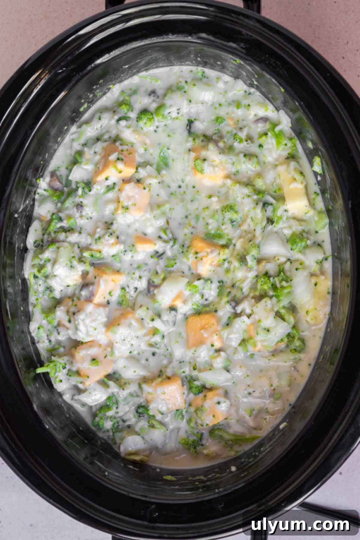The ingredients for the Crockpot Broccoli Rice Casserole have been stirred to combine thoroughly.