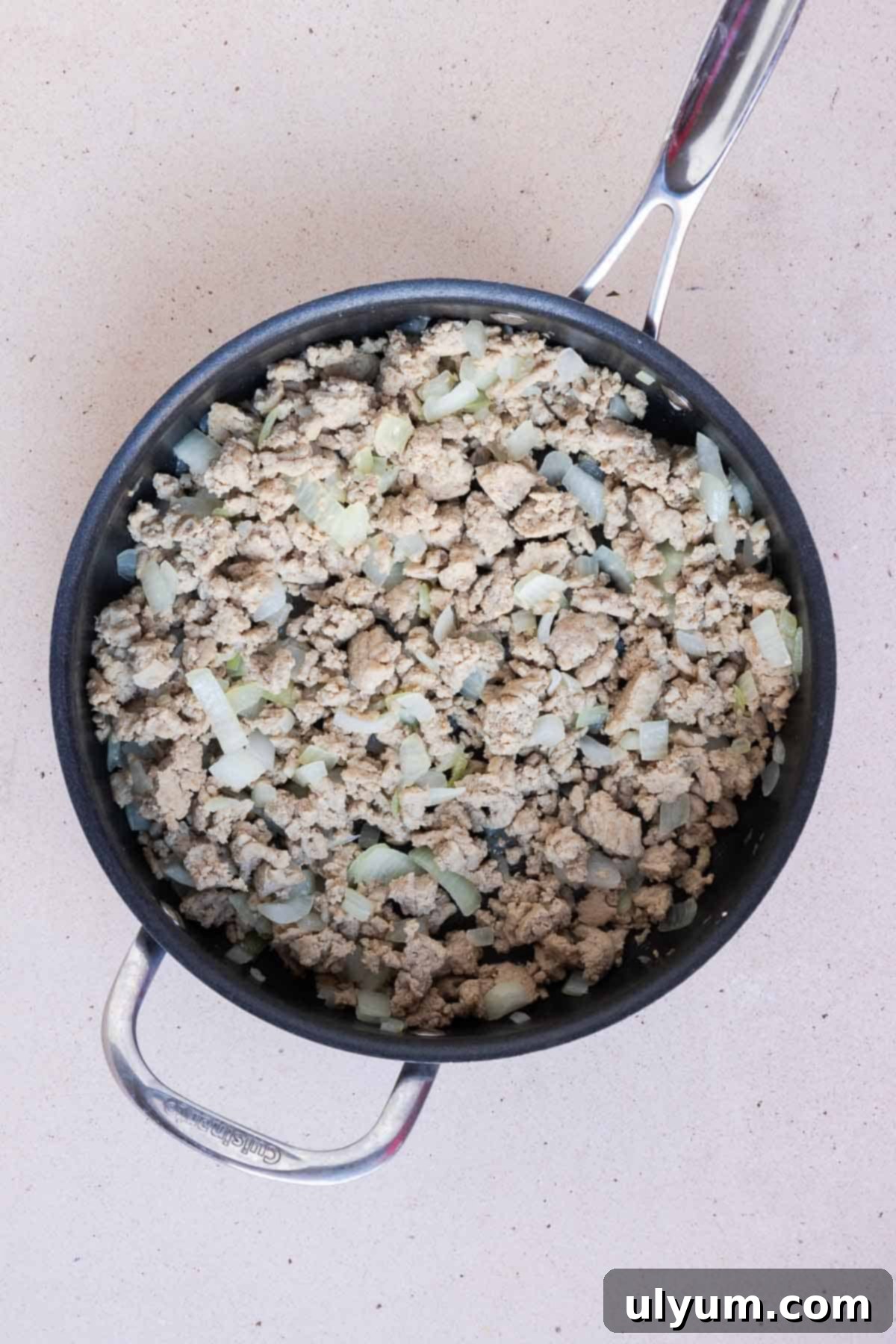 The ground turkey is cooked and the onions are translucent.