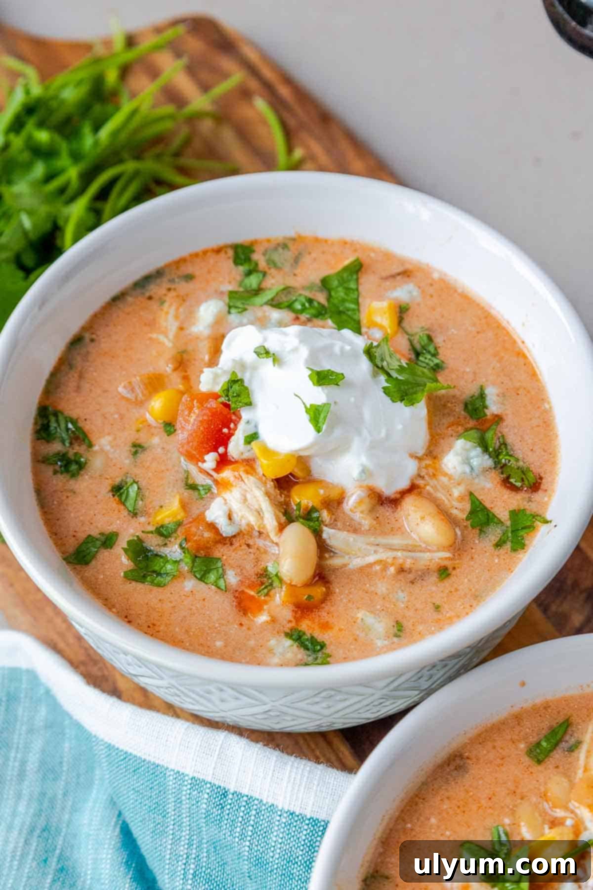 Creamy buffalo chicken chili topped with sour cream.