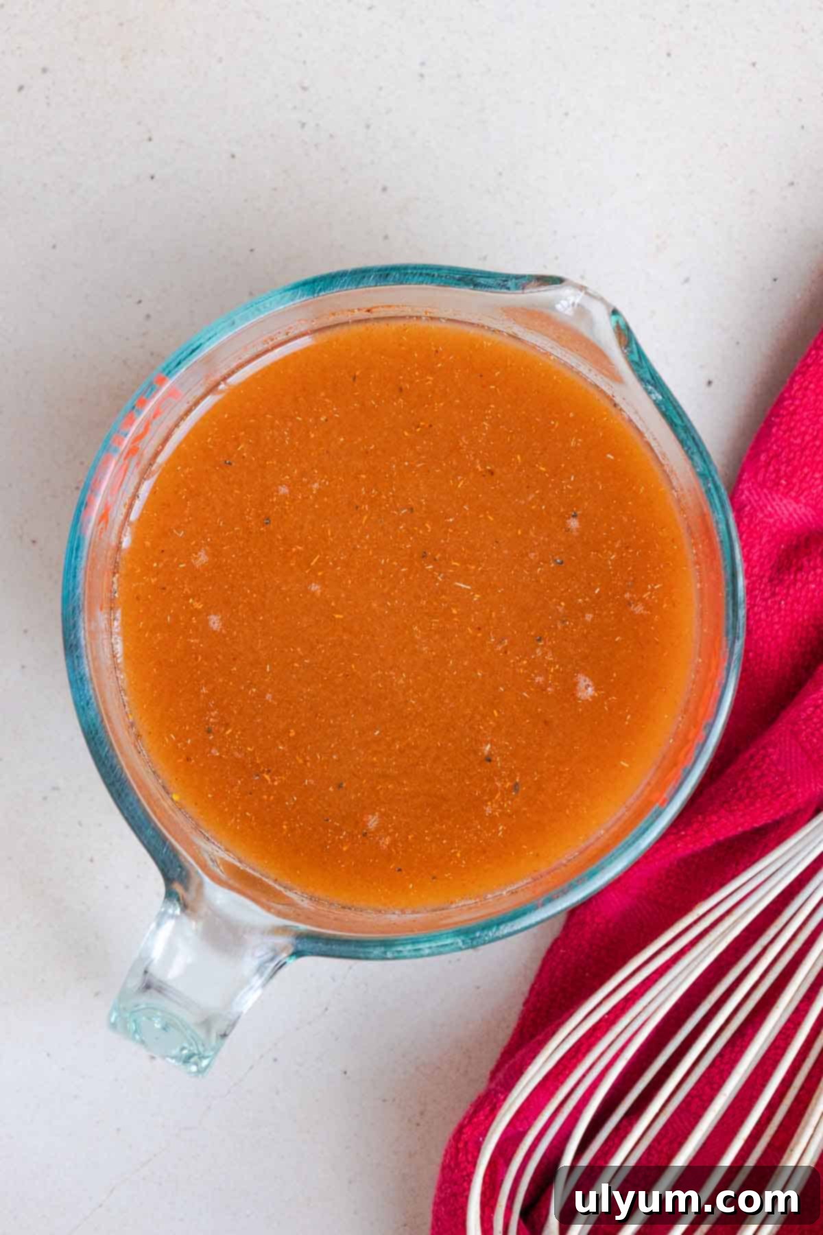 The chili seasonings are mixed with the broth and hot sauce.