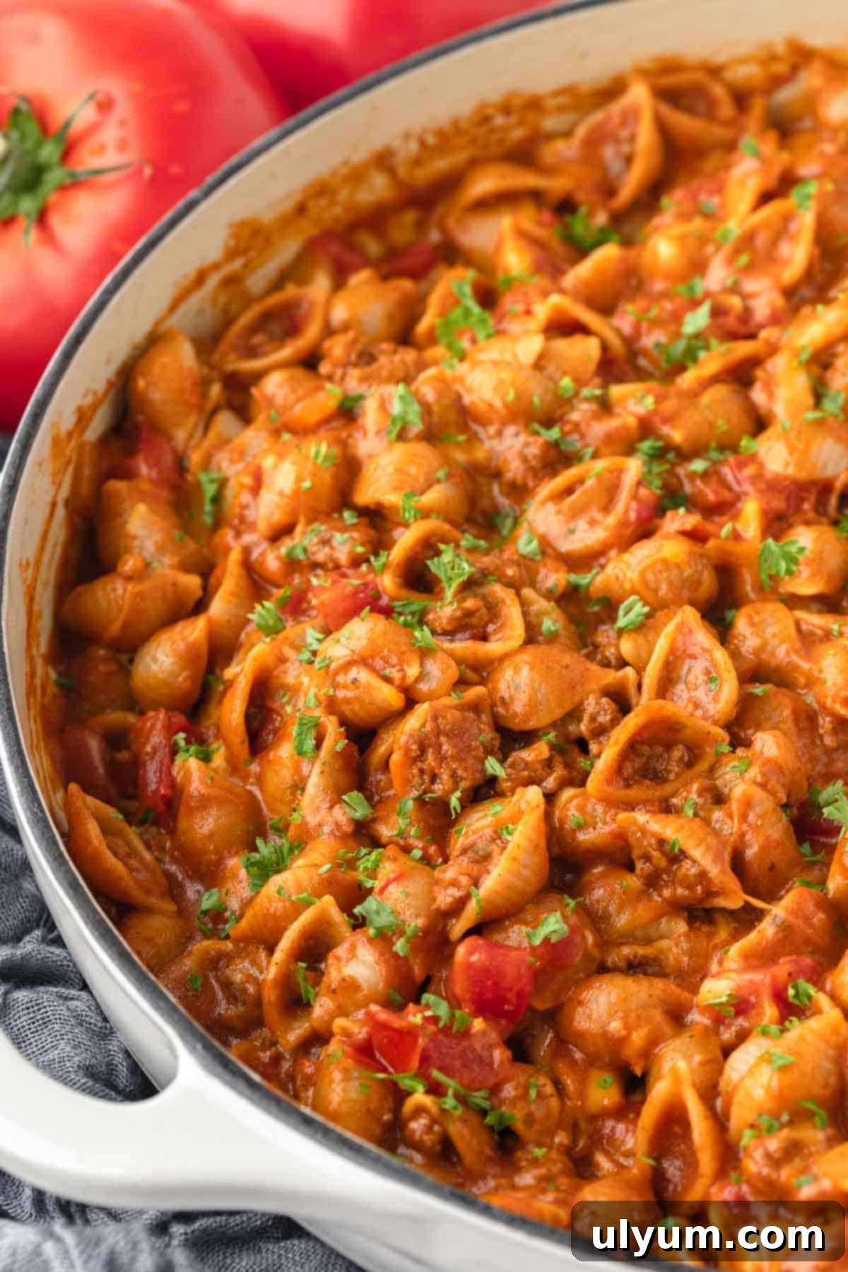 The Ultimate One-Pot Cheesy Taco Pasta 2 Cheese taco pasta garnished with cilantro.