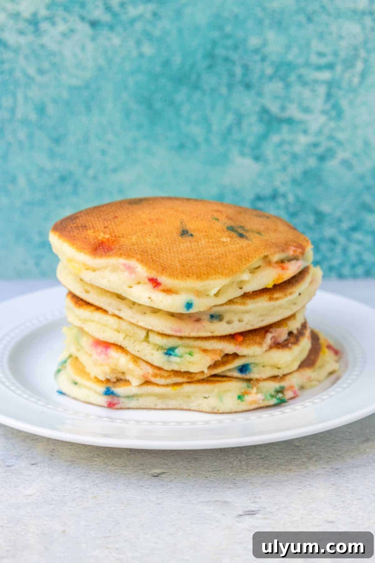 A short stack of Funfetti pancakes cooked until golden brown on both sides.