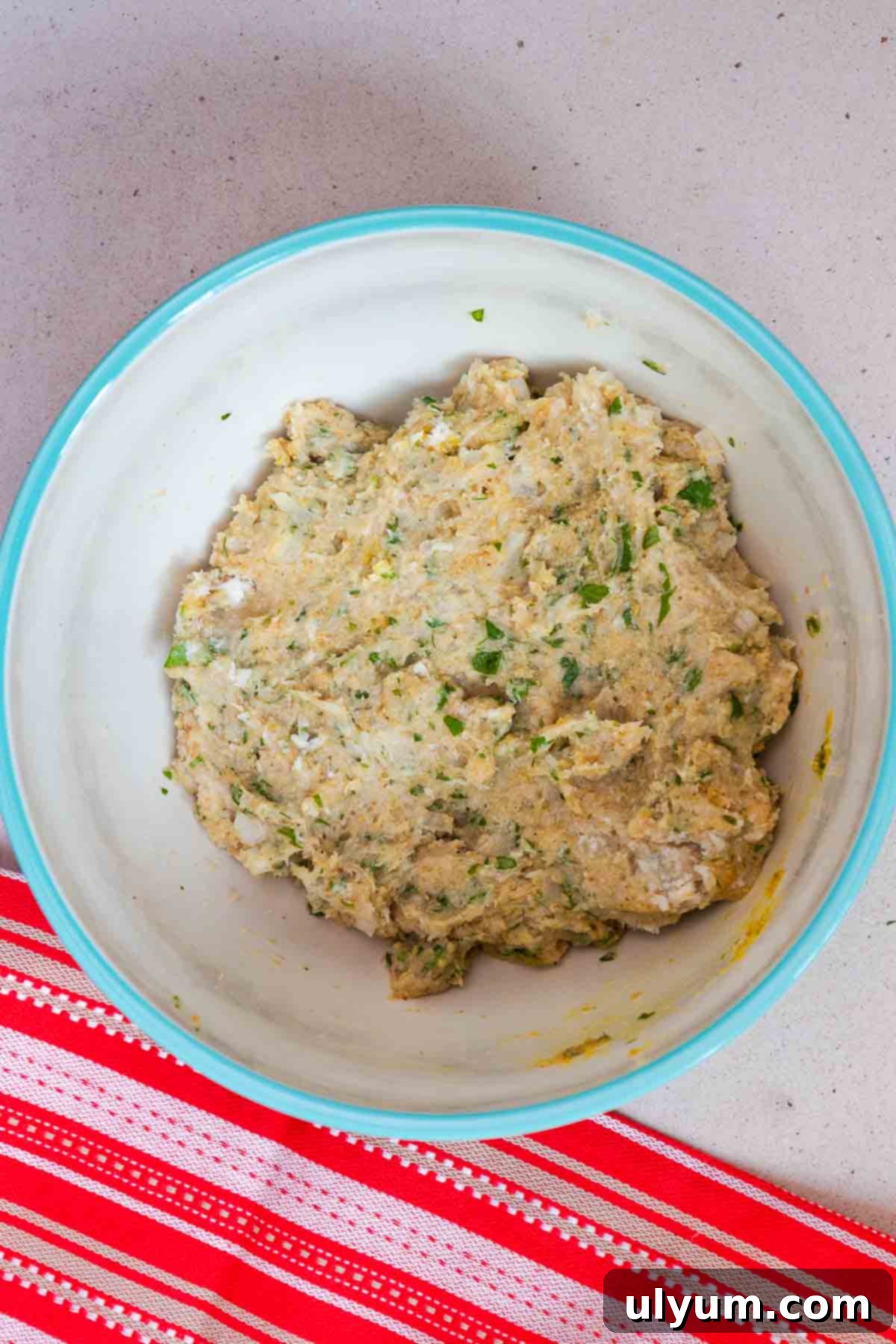 Fettuccine Alfredo with Chicken Meatballs 5 Ground chicken, Italian breadcrumbs, minced onion, grated Parmesan, chopped parsley, egg, Italian seasoning, kosher salt, and black pepper combined in a large mixing bowl into a cohesive meat mixture.