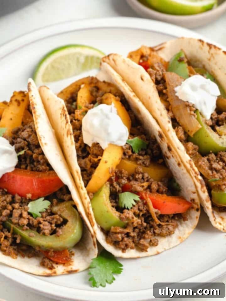 Ground Beef Fajitas served sizzling with bell peppers.