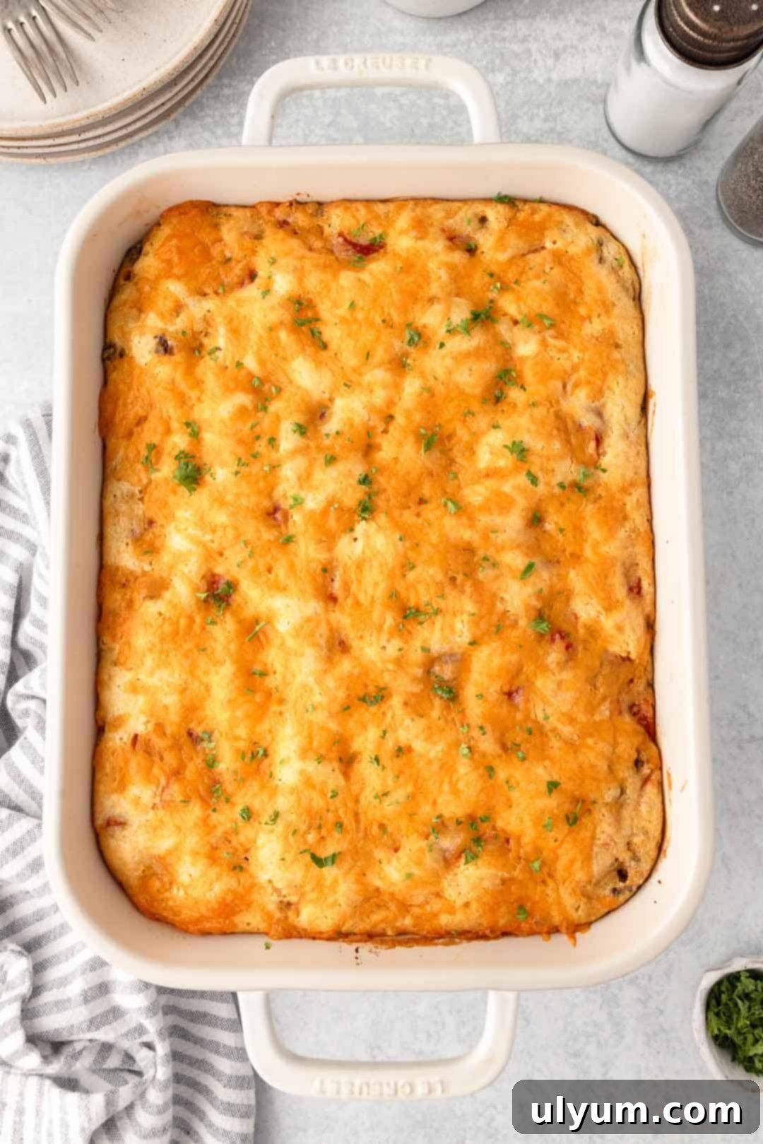 Ground Beef Jiffy Cornbread Casserole baked to golden perfection in a 9 by 13 inch baking dish.