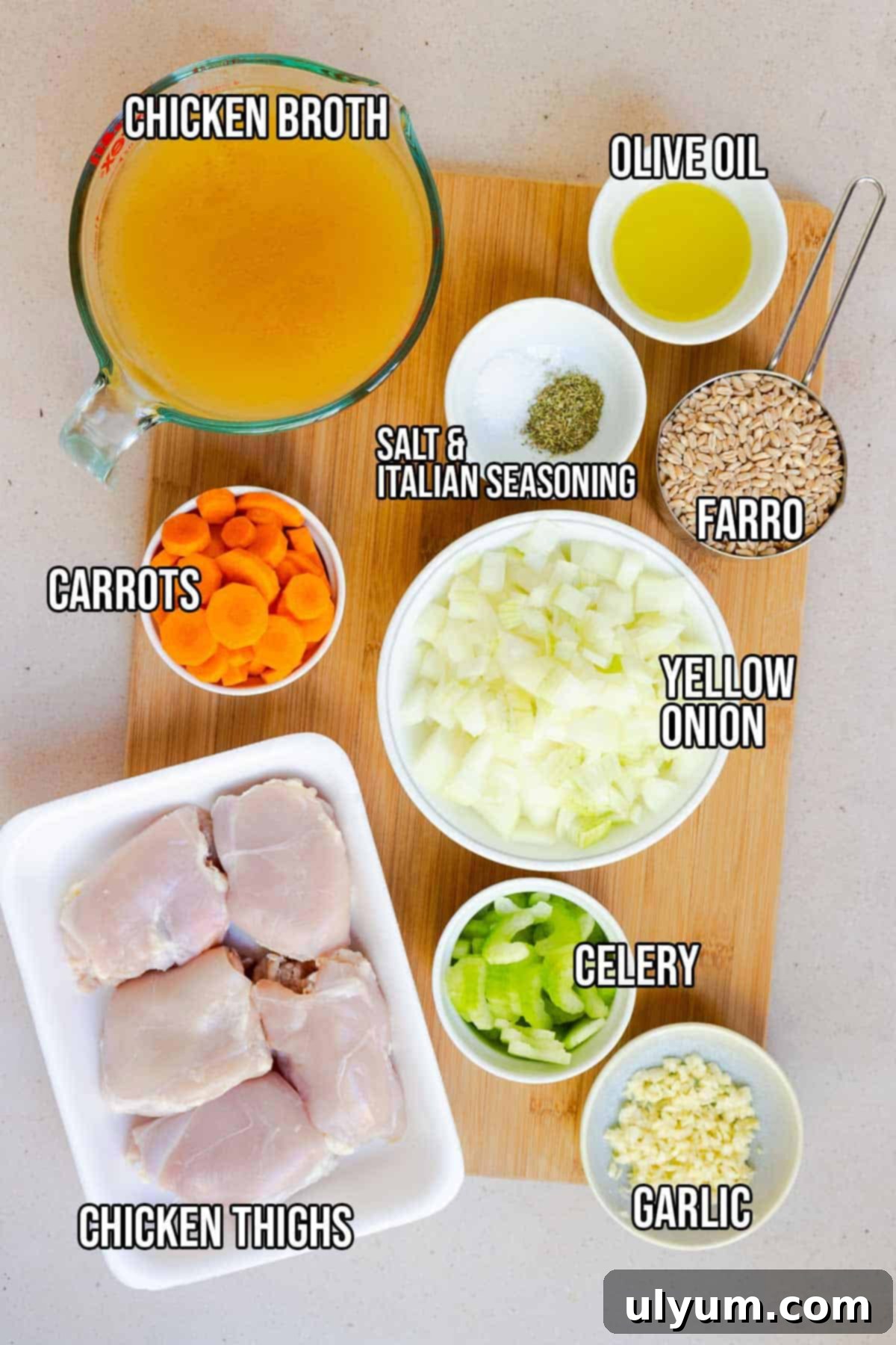 Chicken soup with farro ingredients: olive oil, onion, carrots, celery, garlic, chicken broth, Italian seasoning, salt, chicken thighs, and farro.