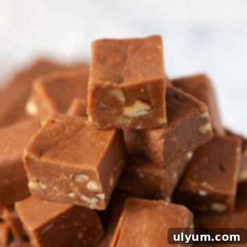 One inch squares of Velveeta fudge stacked into a pyramid.