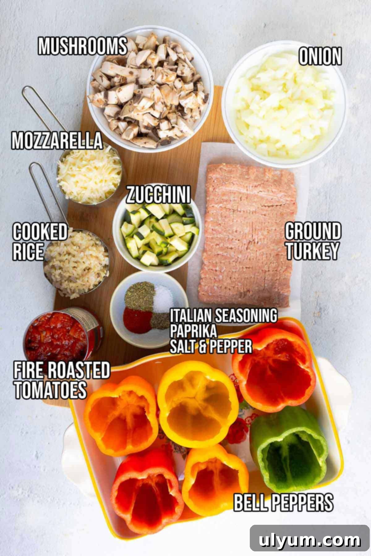 Hearty Ground Turkey and Rice Stuffed Peppers 3 All the fresh ingredients for turkey stuffed bell peppers laid out: ground turkey, bell peppers, diced onion, diced mushrooms, diced zucchini, fire roasted tomatoes, cooked rice, paprika, Italian seasoning, salt, pepper, and shredded mozzarella.