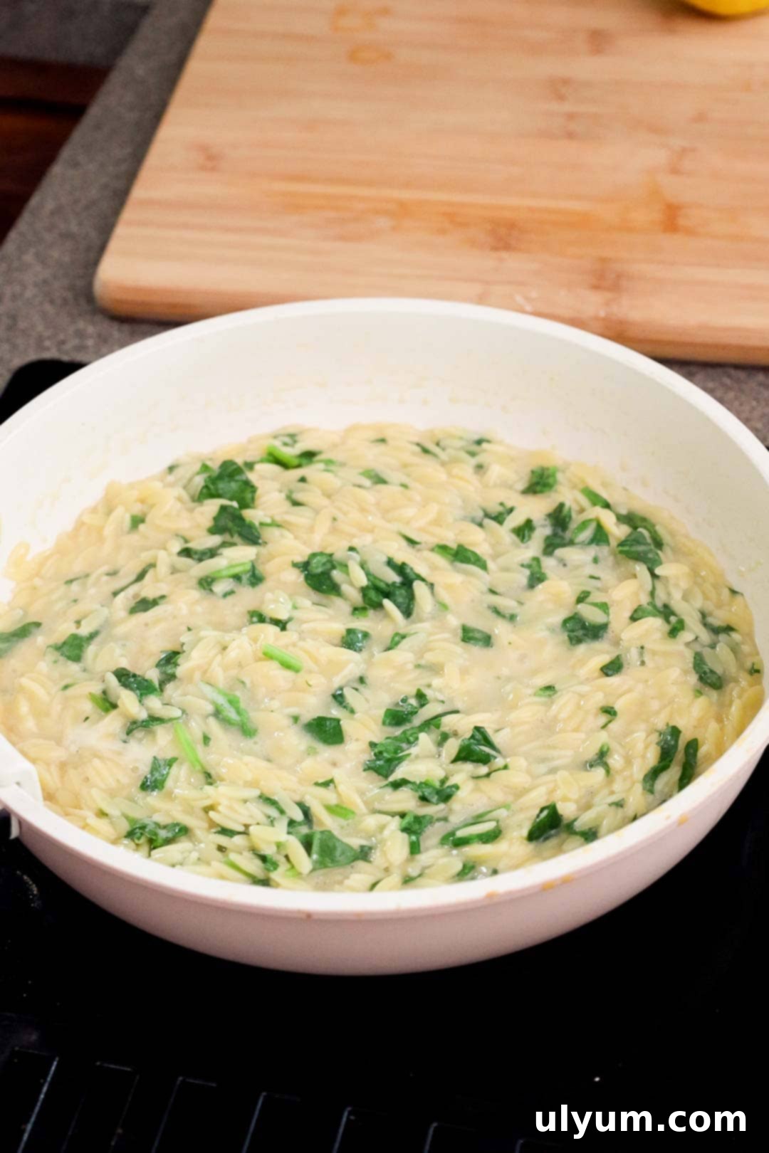Bright Lemon Chicken Orzo Skillet 7 Chopped baby spinach wilted into orzo pasta.