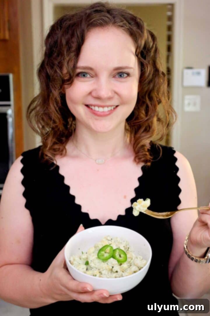 Spicy Creamy Jalapeño Ranch Pasta 13 Kelsey Smith holding a bowl of creamy jalapeño ranch pasta.