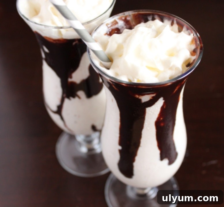 Baileys Pumpkin Spice Mudslide Recipe, garnished with whipped cream and a cinnamon stick, ready for a fall celebration.