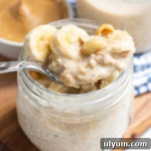 Peanut Butter Overnight Oats in a mason jar with banana slices on top.