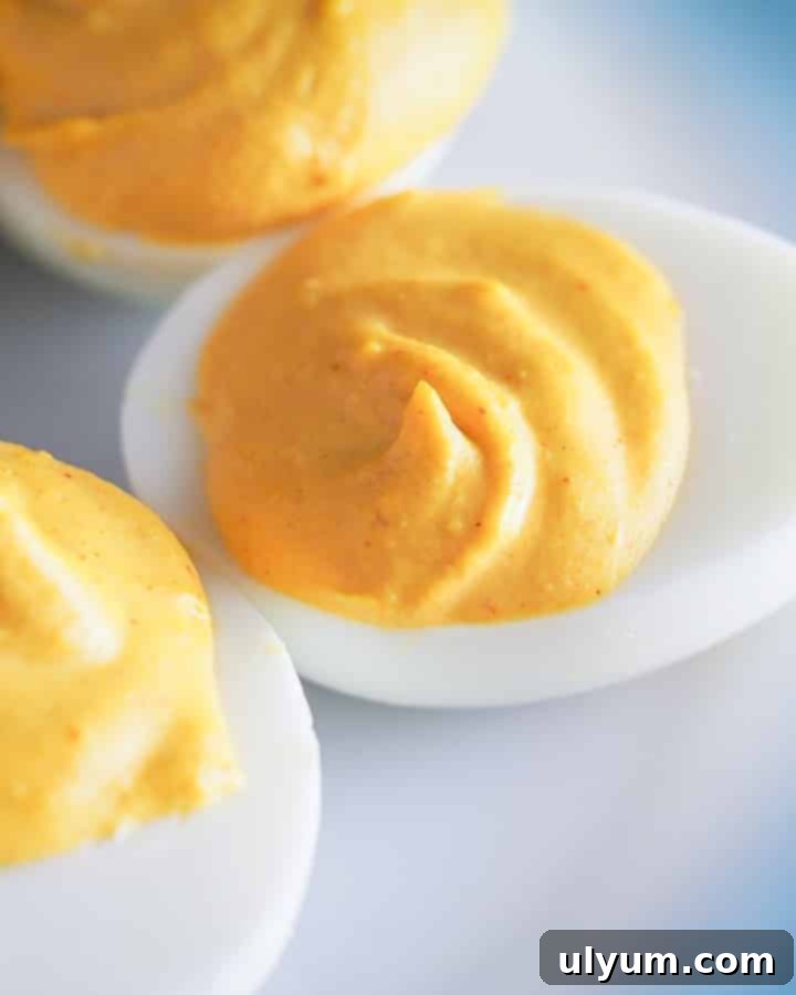 Score Big: 48 Instant Pot & Slow Cooker Game Day Eats 21 Instant Pot Deviled Eggs, perfectly hard-boiled for easy peeling.