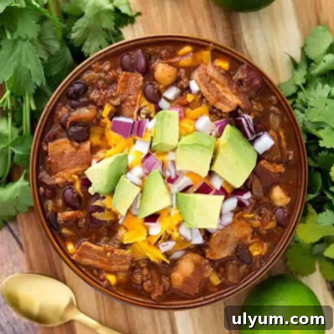 Score Big: 48 Instant Pot & Slow Cooker Game Day Eats 29 Slow Cooker Beefy Bacon Chili, hearty and flavorful.