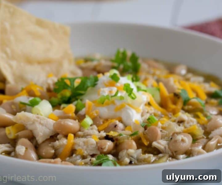 Score Big: 48 Instant Pot & Slow Cooker Game Day Eats 30 Slow Cooker White Chicken Chili, a delicious and easy dish.