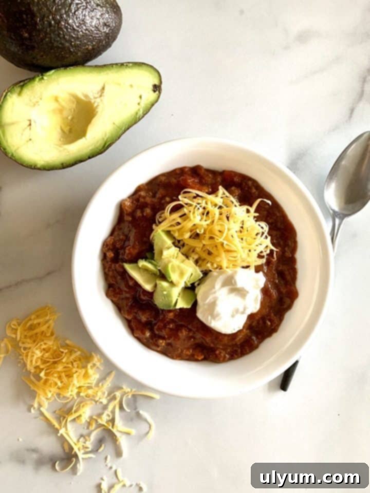 Score Big: 48 Instant Pot & Slow Cooker Game Day Eats 32 Slow Cooker Beef and Bacon Chili (no beans), a low-carb keto option.