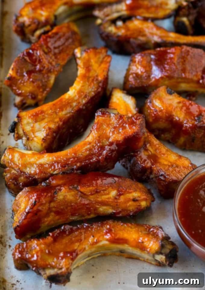 Score Big: 48 Instant Pot & Slow Cooker Game Day Eats 35 Slow Cooker Ribs, tender pork baby back ribs in BBQ sauce.