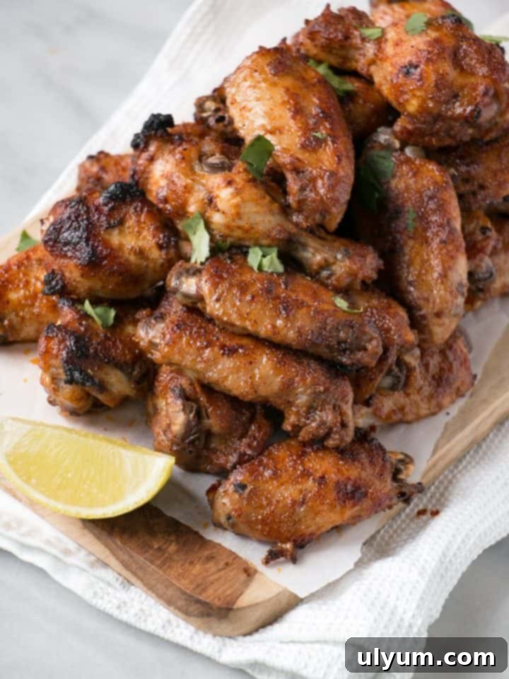 Score Big: 48 Instant Pot & Slow Cooker Game Day Eats 38 Instant Pot Chili Lime Chicken Wings, perfectly seasoned and juicy.