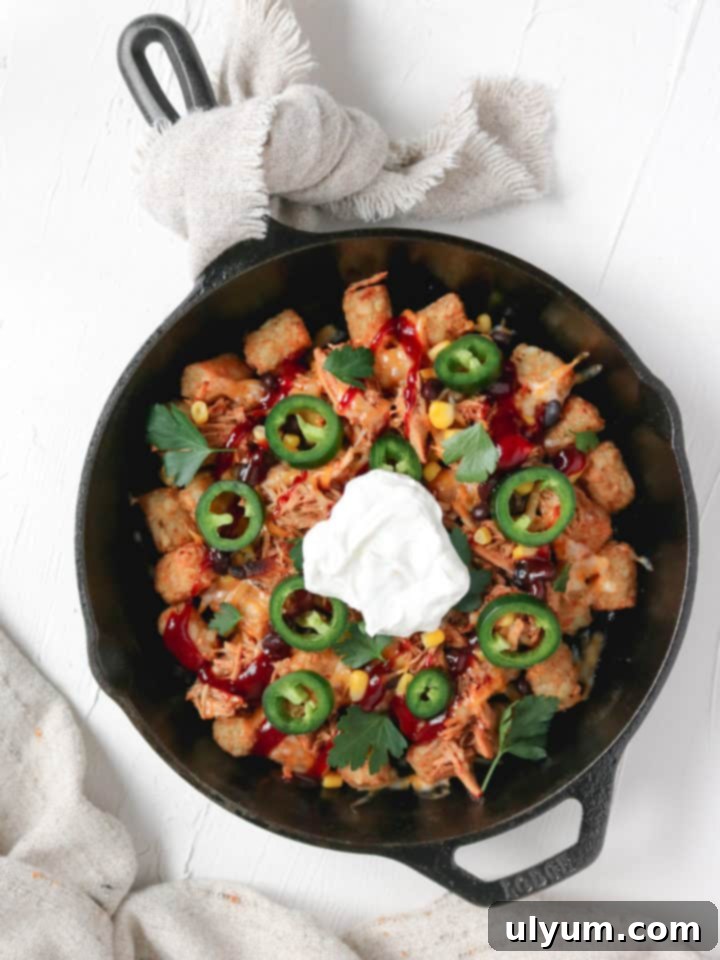 Score Big: 48 Instant Pot & Slow Cooker Game Day Eats 41 Slow Cooker BBQ Pulled Pork Loaded Tater Tots, crispy and topped with savory pork.
