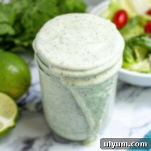Avocado lime ranch dressing in a small mason jar.