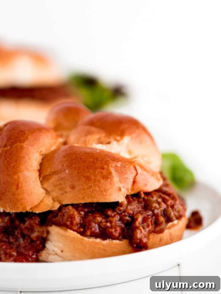Instant Pot Sloppy Joes on a bun with cheese.