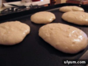 Pancake batter on the griddle.