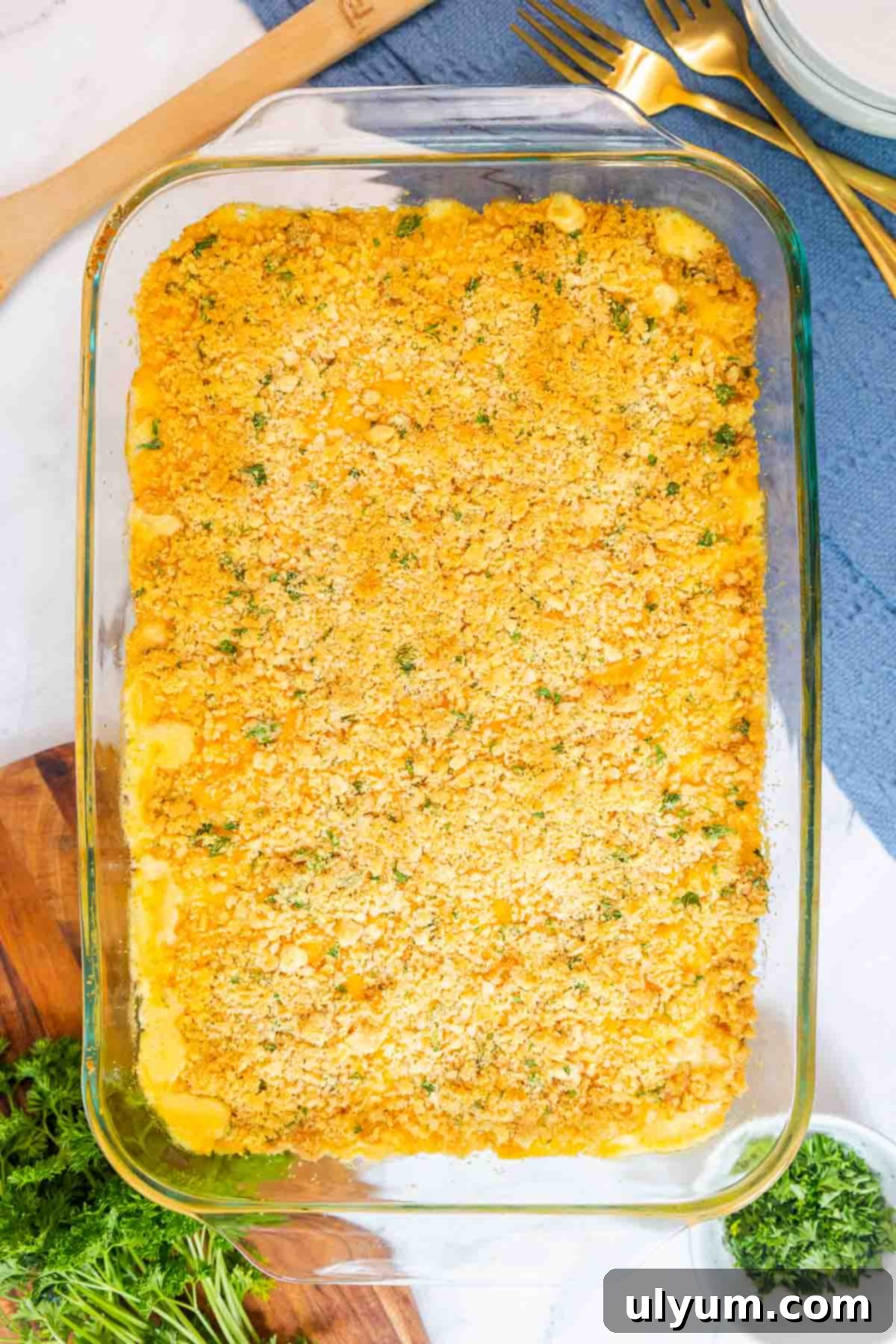 Freshly baked old fashioned mac and cheese with a crisp, golden Ritz cracker crust in a glass baking dish.