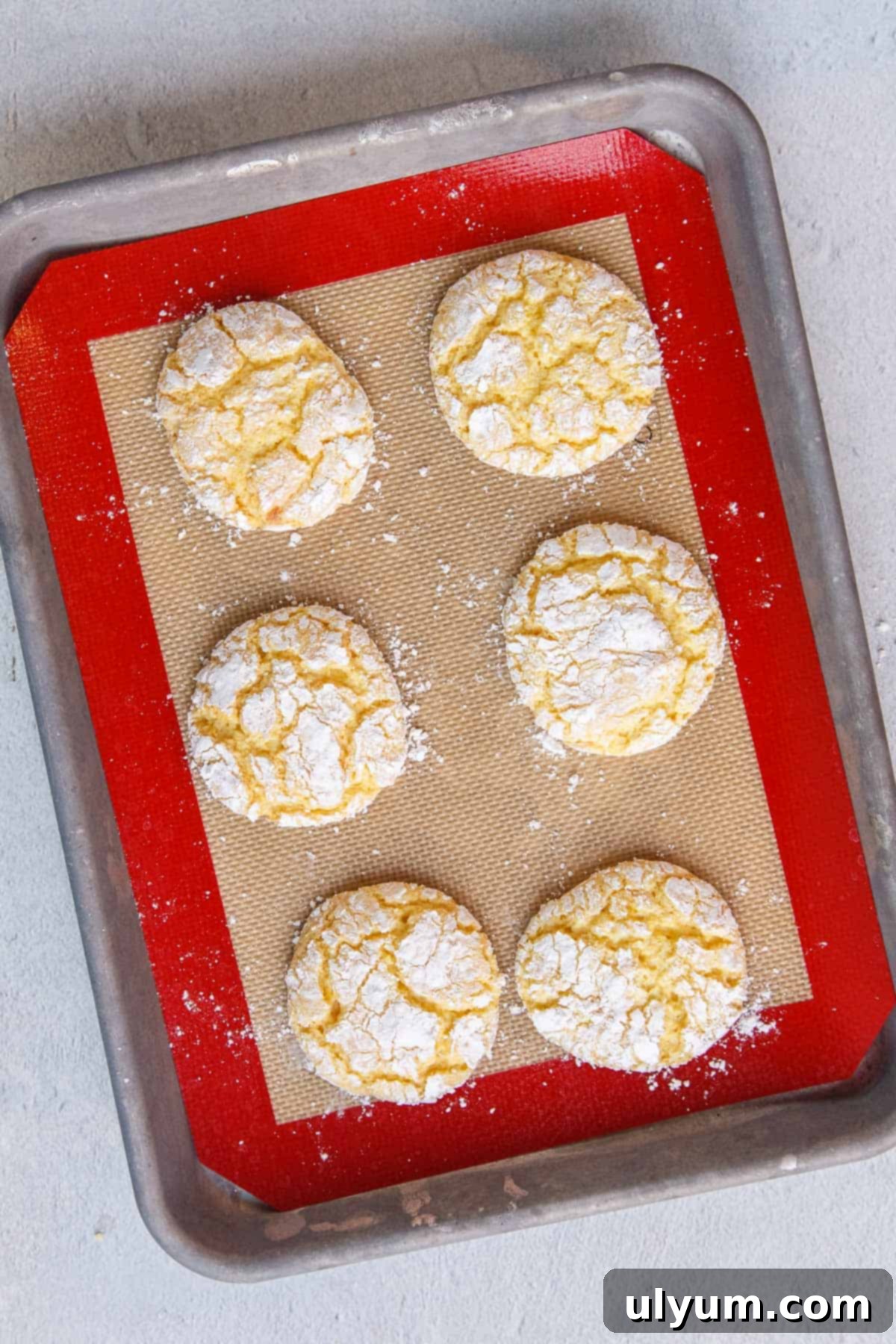 Baked Lemon Cool Whip Cookies on a Baking Sheet